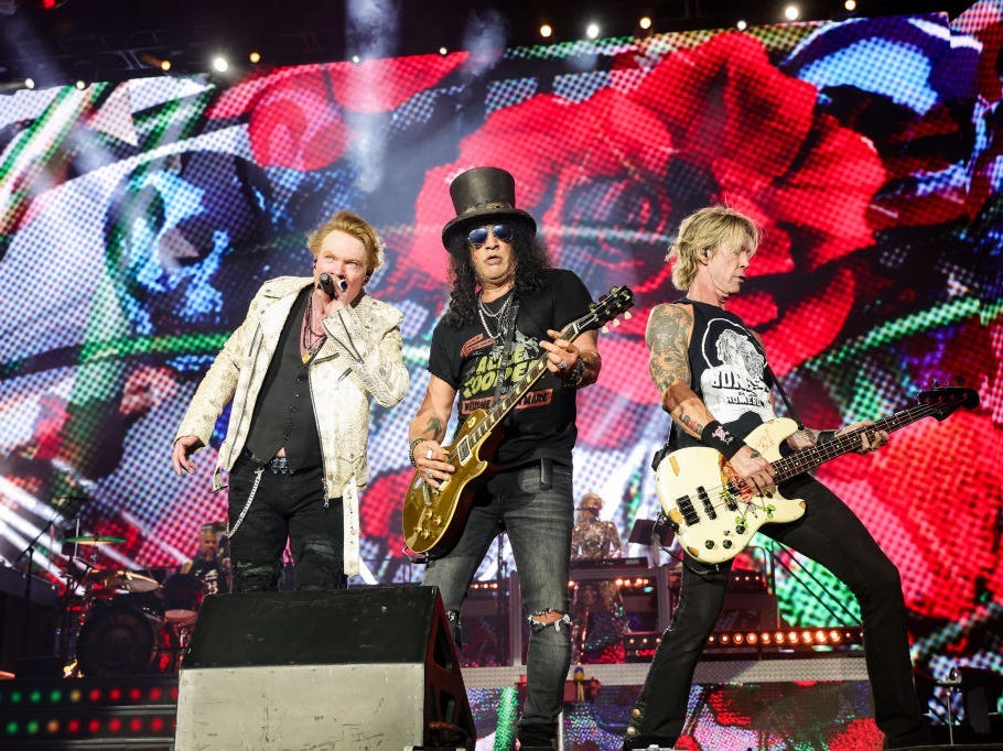 Axl Rose, Slash, and Duff McKagan of Guns N' Roses perform onstage during the Power Trip music festival at Empire Polo Club on October 06, 2023 in Indio, California.
