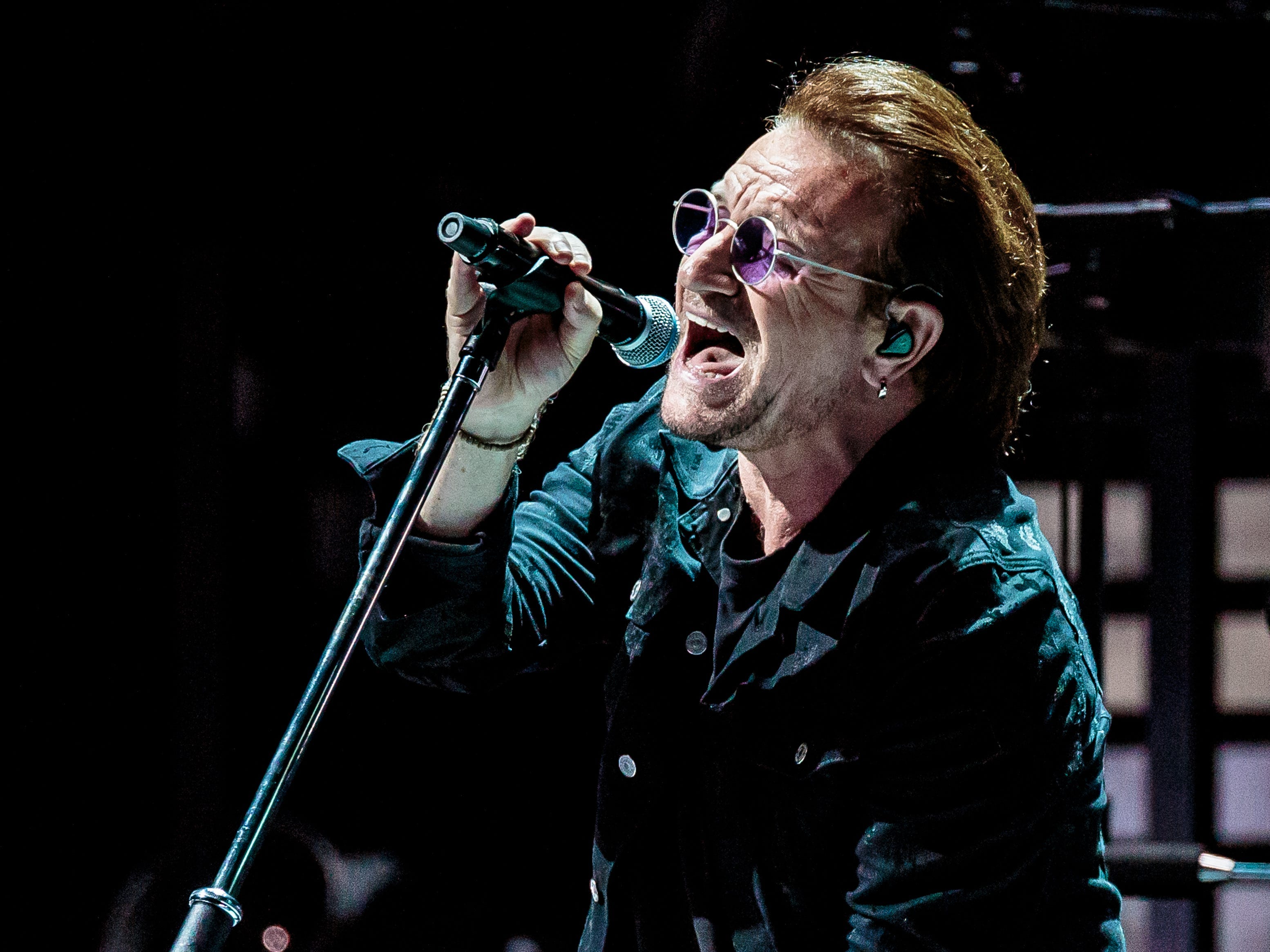 : Bono of U2 performs on stage at Mediolanum Forum on October 12, 2018 in Milan, Italy.