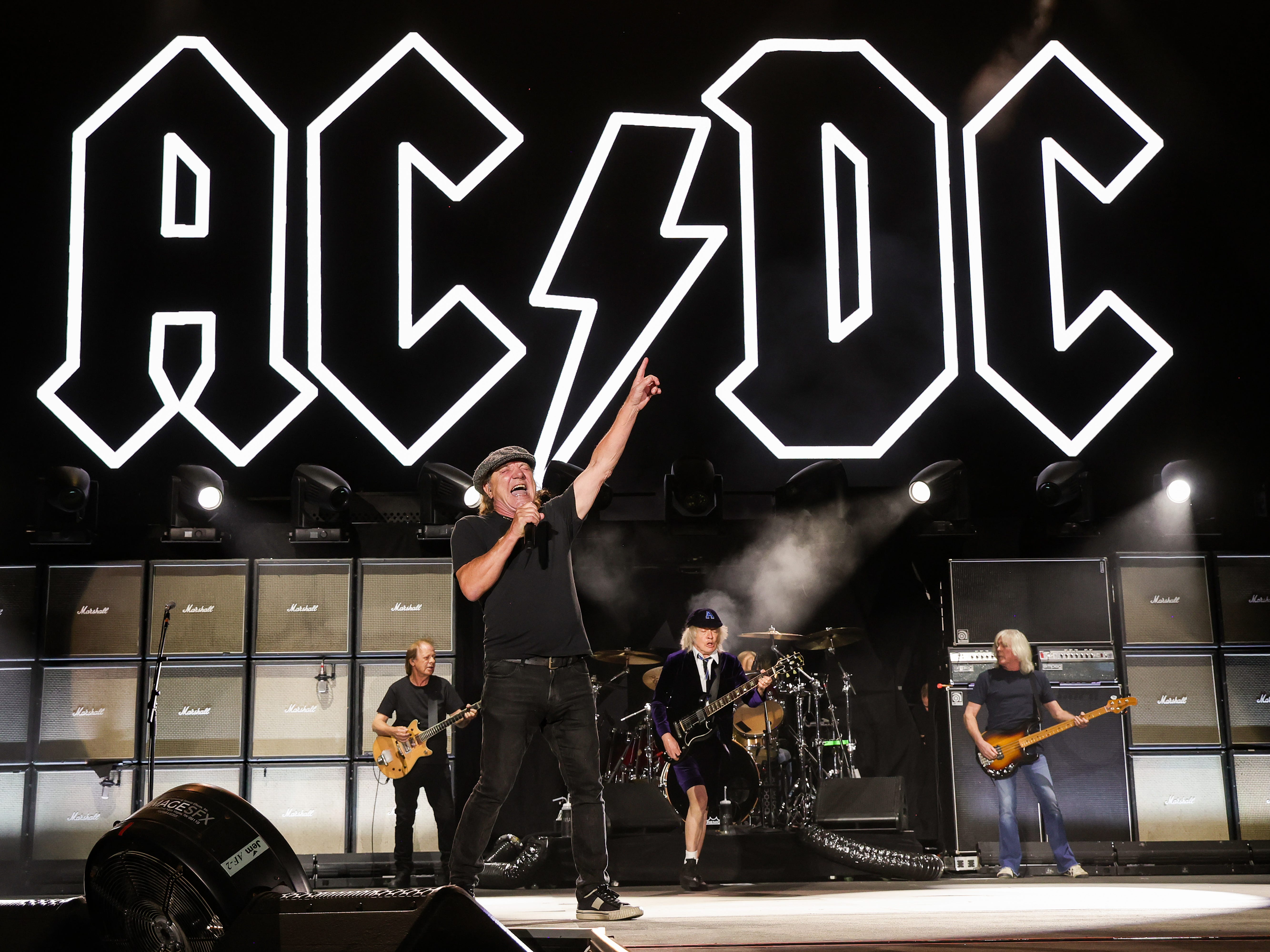 Stevie Young, Brian Johnson, Angus Young, and Cliff Williams of AC/DC perform onstage during the Power Trip music festival at Empire Polo Club on October 07, 2023