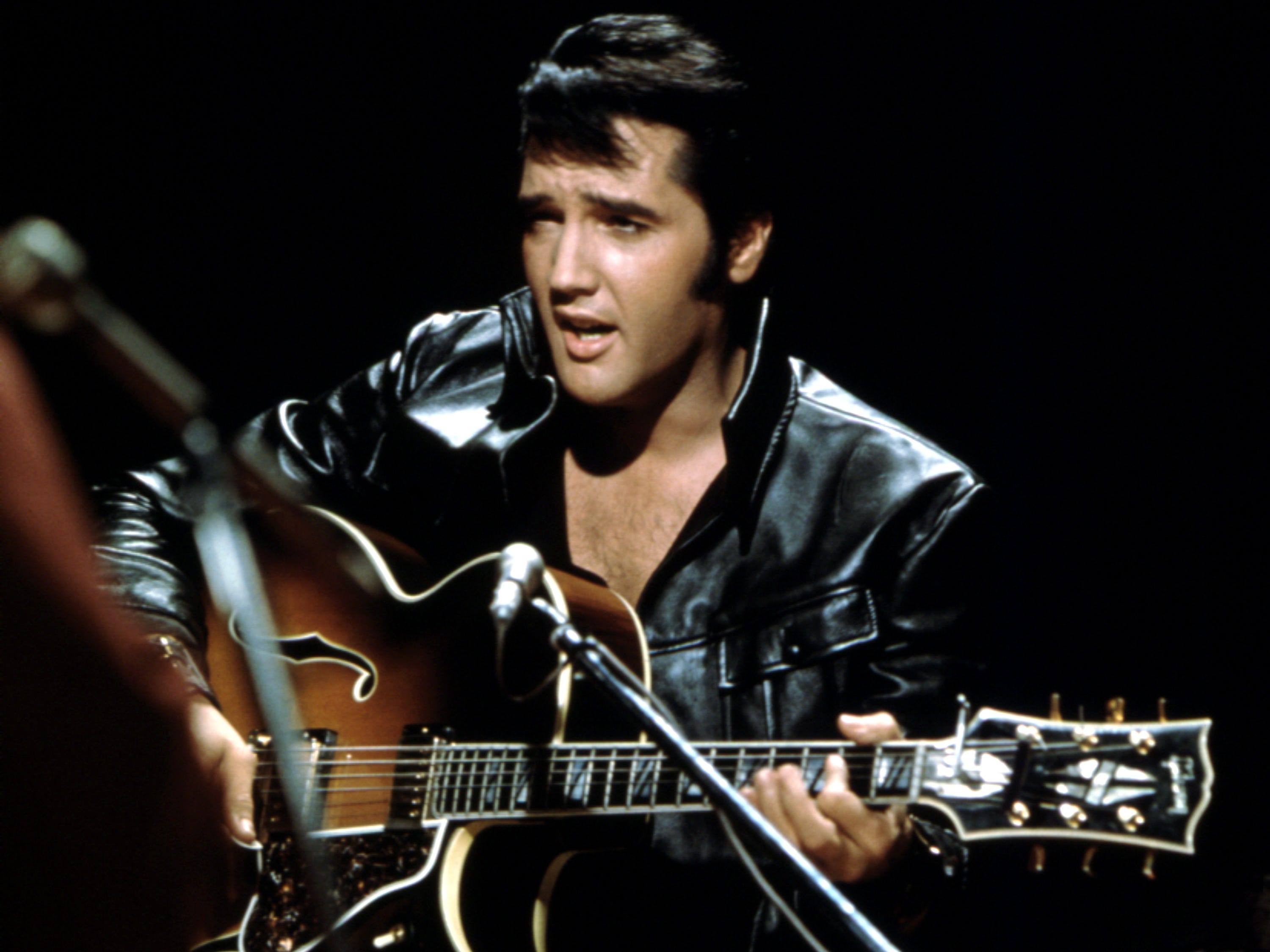 Rock and roll musician Elvis Presley performing on the Elvis comeback TV special on June 27, 1968.