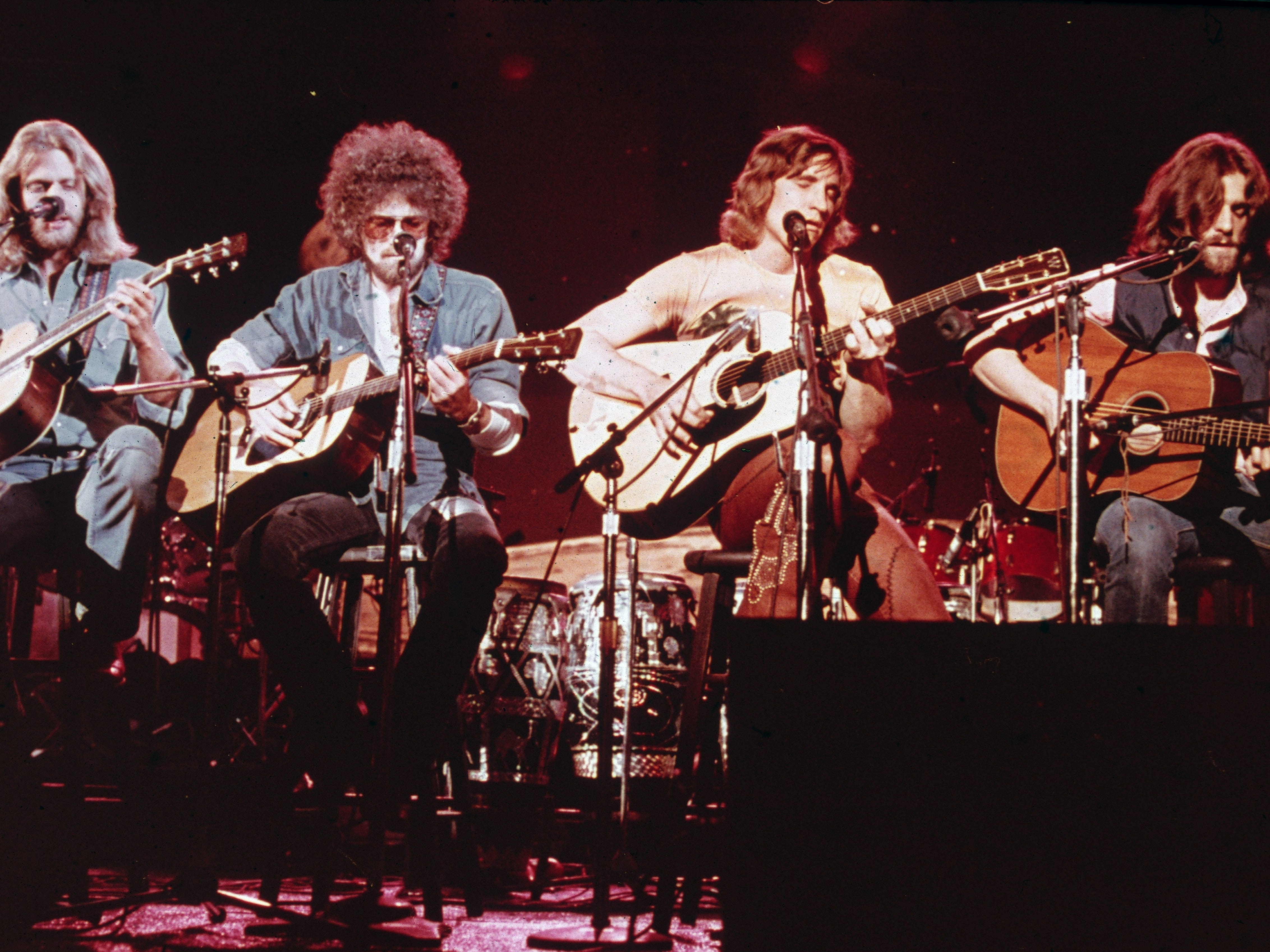Members of the American soft-rock ensemble The Eagles sit on chairs as the perform on the television show 'Don Kirschner's Rock Concert,' 1979. Bandmembers are (left to right) Glenn Frey, Don Henley, Joe Walsh, and Don Felder.