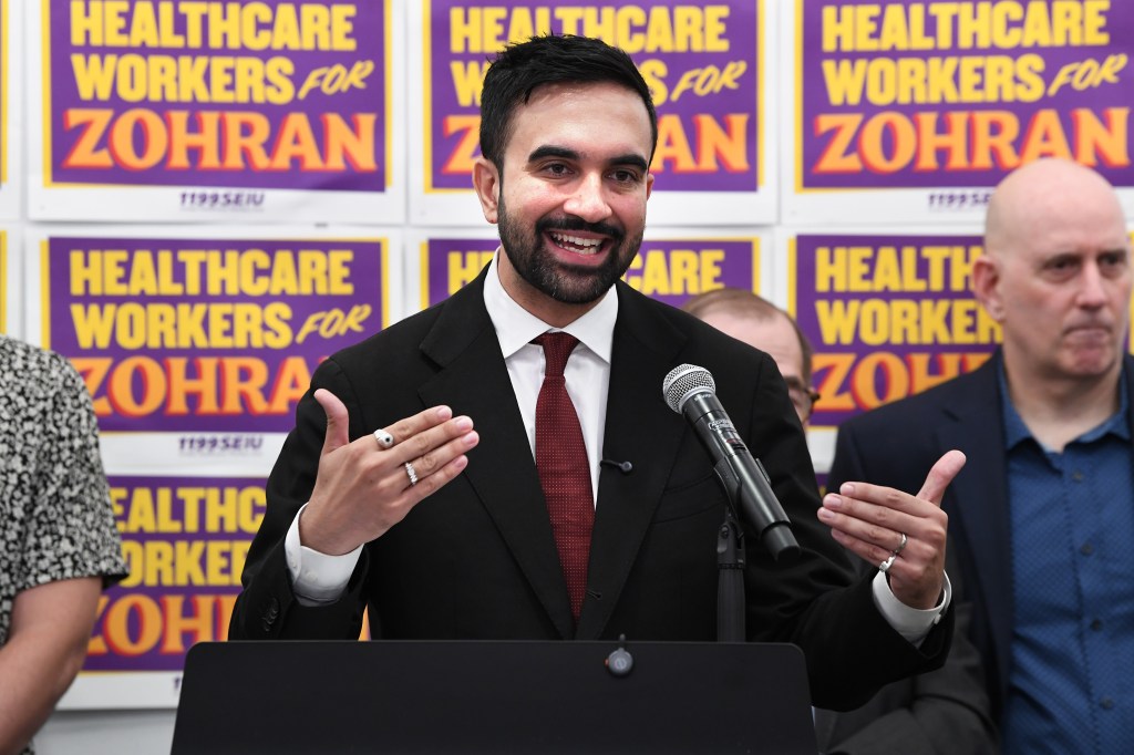 Zohran Mamdani speaking at a press conference.