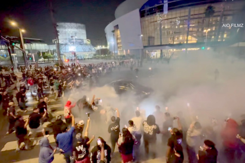 Street takeover near Crypto.com Arena with over 100 vehicles.