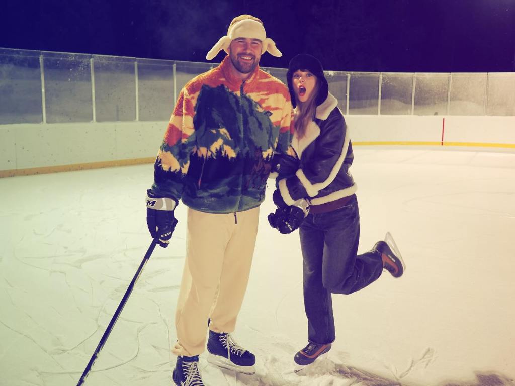Taylor Swift and Travis Kelce pose together.