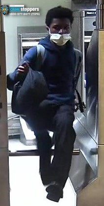 Surveillance image of a person of interest in a subway station.