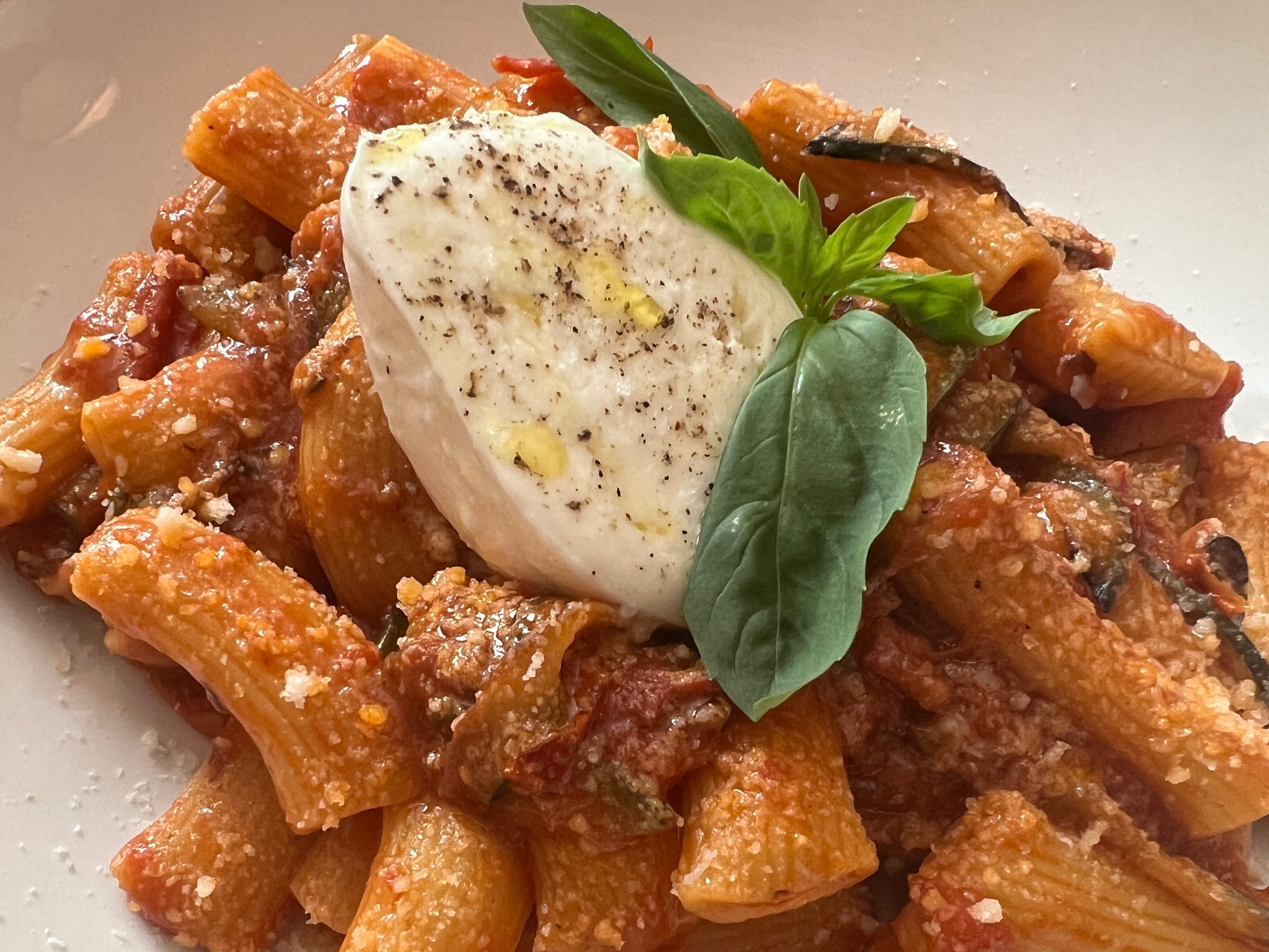 plate of pasta with burrata