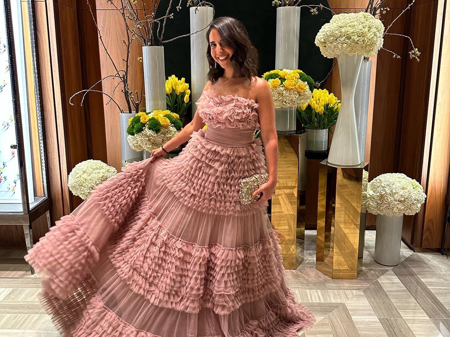 laifah posing in a fancy dress at a dress store in toronto