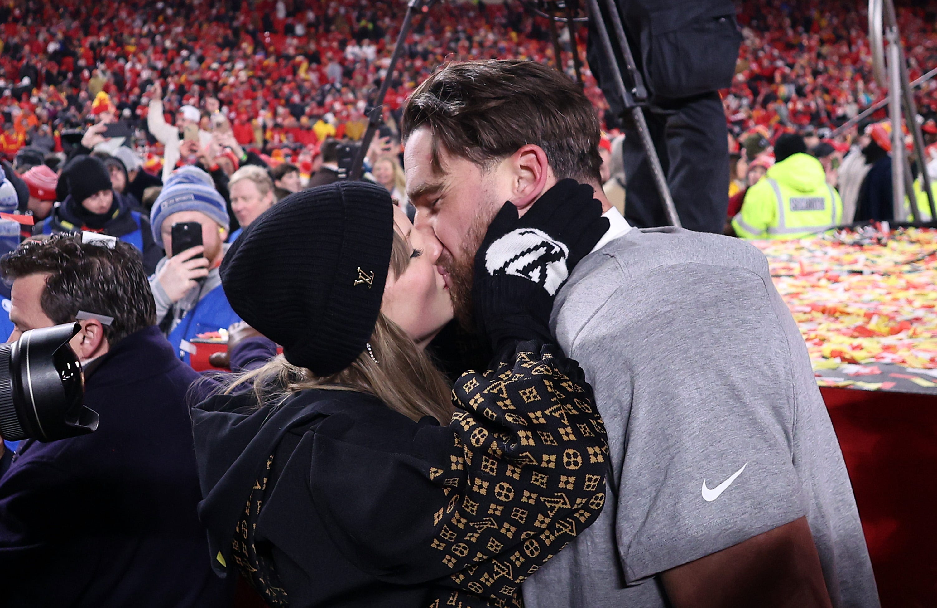 Taylor Swift and Travis Kelce celebrate the Chiefs becoming 2025 AFC champions.