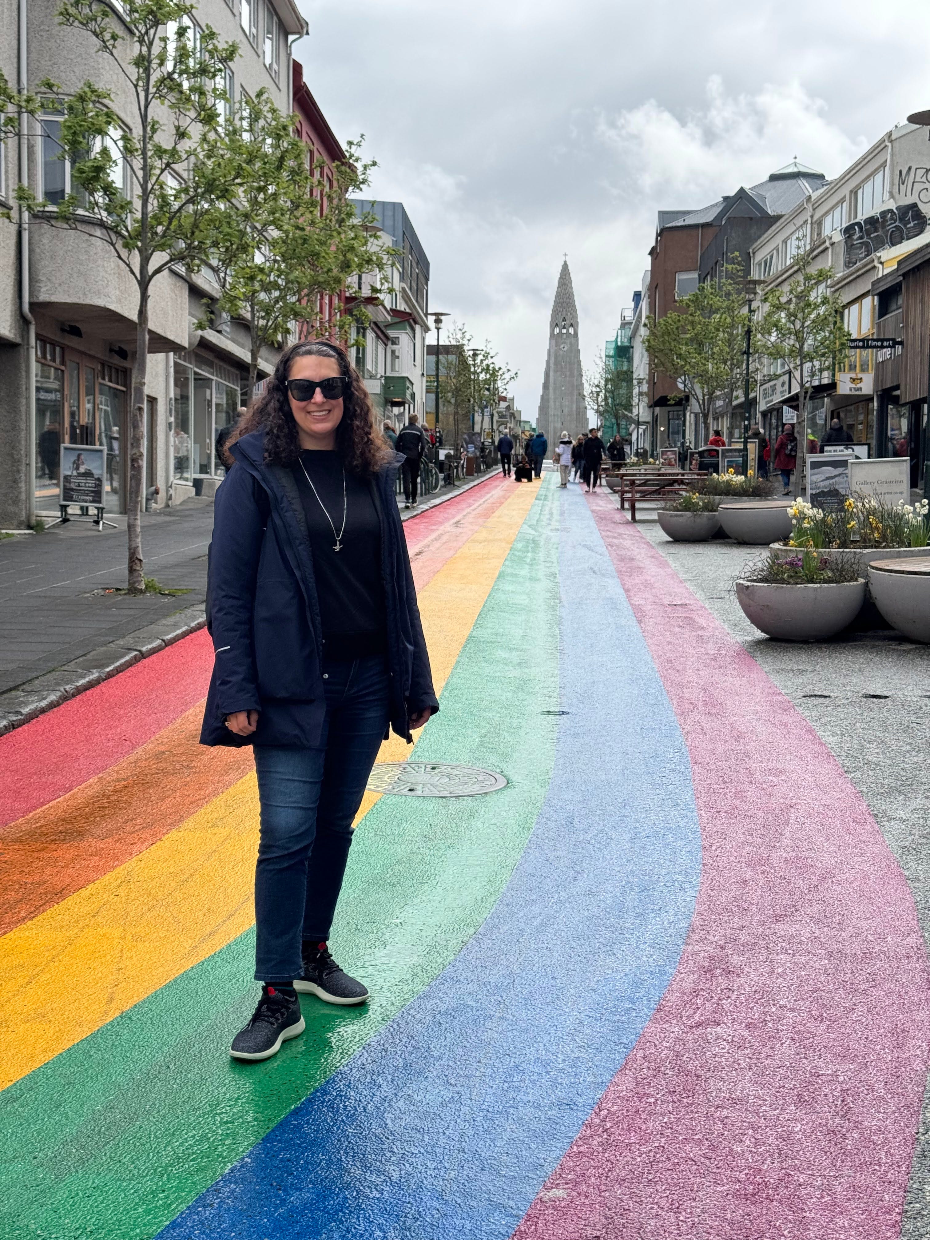 Author Author Jamie Davis Smith on rainbow-painted street in Iceland
