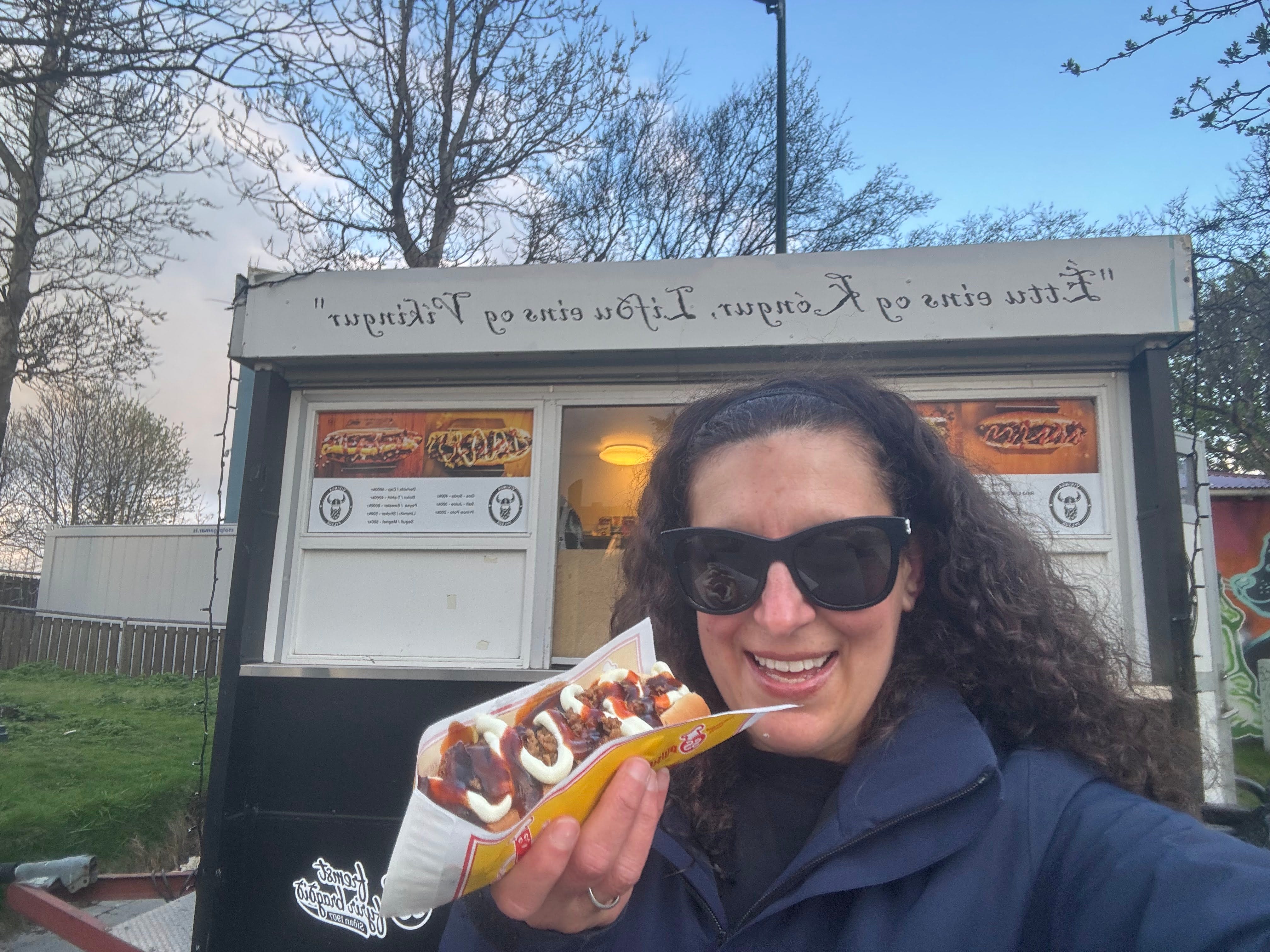 Author Jamie Davis Smith with hot dog in Iceland