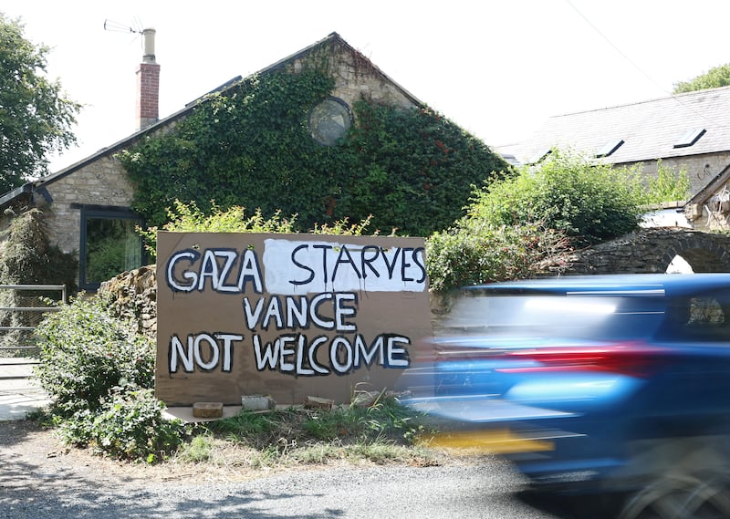 A protest message is displayed at a roadside property, whilst U.S. Vice President JD Vance spends his holiday nearby, near Chipping Norton, Cotswolds, Britain, August 12, 2025. REUTERS/Toby Melville