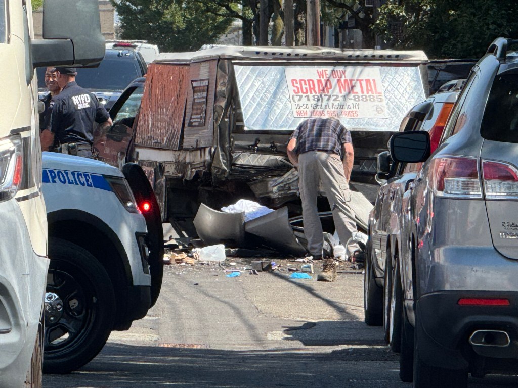 The scene of a fatal crash in Astoria Queens Tuesday, Aug. 12, 2025. An 84-year-old driver struck and killed two pedestrians ordering at a food truck near 19 Avenue and 42 Street.