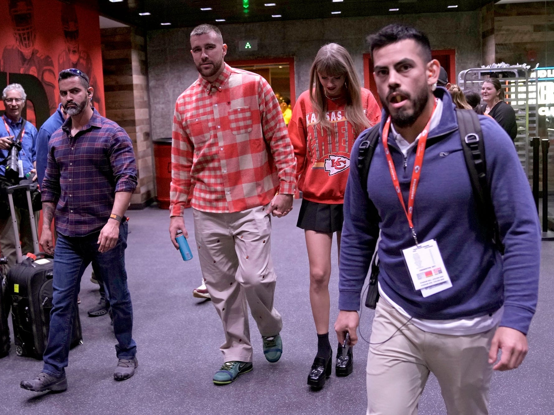 Travis Kelce and Taylor Swift exit Arrowhead Stadium on October 22, 2023.