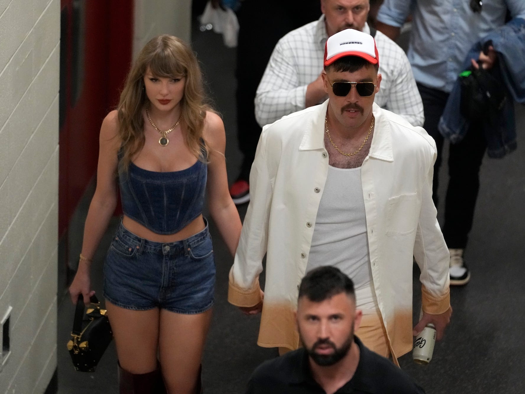 Taylor Swift and Travis Kelce exit Arrowhead Stadium on September 5, 2024.