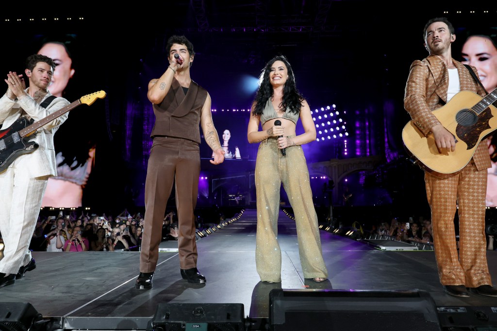 Demi Lovato performs with The Jonas Brothers in New Jersey.