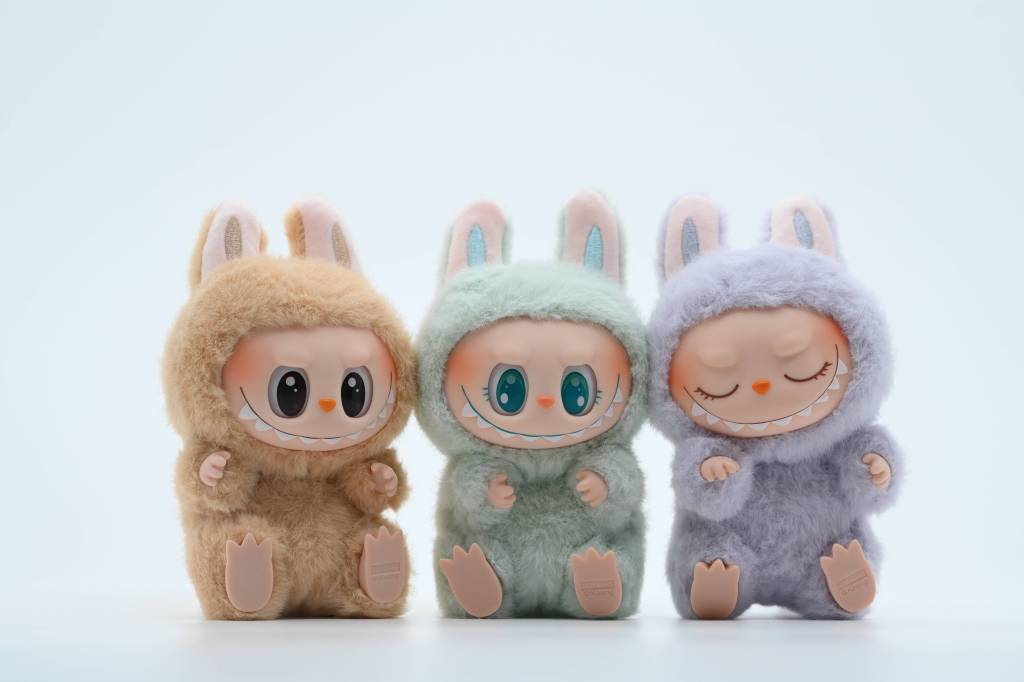 Three plush toys in bunny costumes.