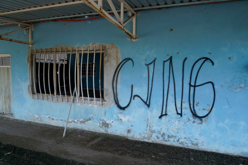 Graffiti on a blue wall.