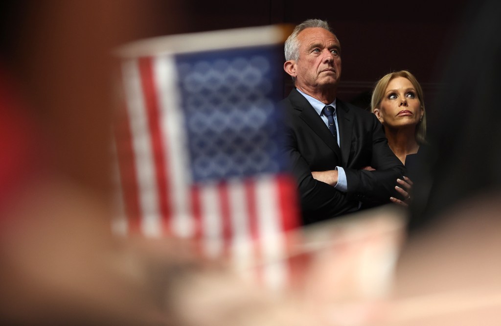 OAKLAND, CALIFORNIA - MARCH 26: Actress Cheryl Hines and her husband, Independent presidential candidate Robert F. Kennedy Jr., look on during a campaign event to announce his pick for a running mate at the Henry J. Kaiser Event Center on March 26, 2024 in Oakland, California. Independent presidential candidate Robert F. Kennedy Jr. announced Silicon Valley attorney Nicole Shanahan as his running mate. (Photo by Justin Sullivan/Getty Images)