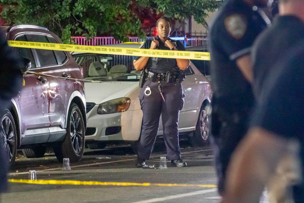 NYPD officer at a crime scene.