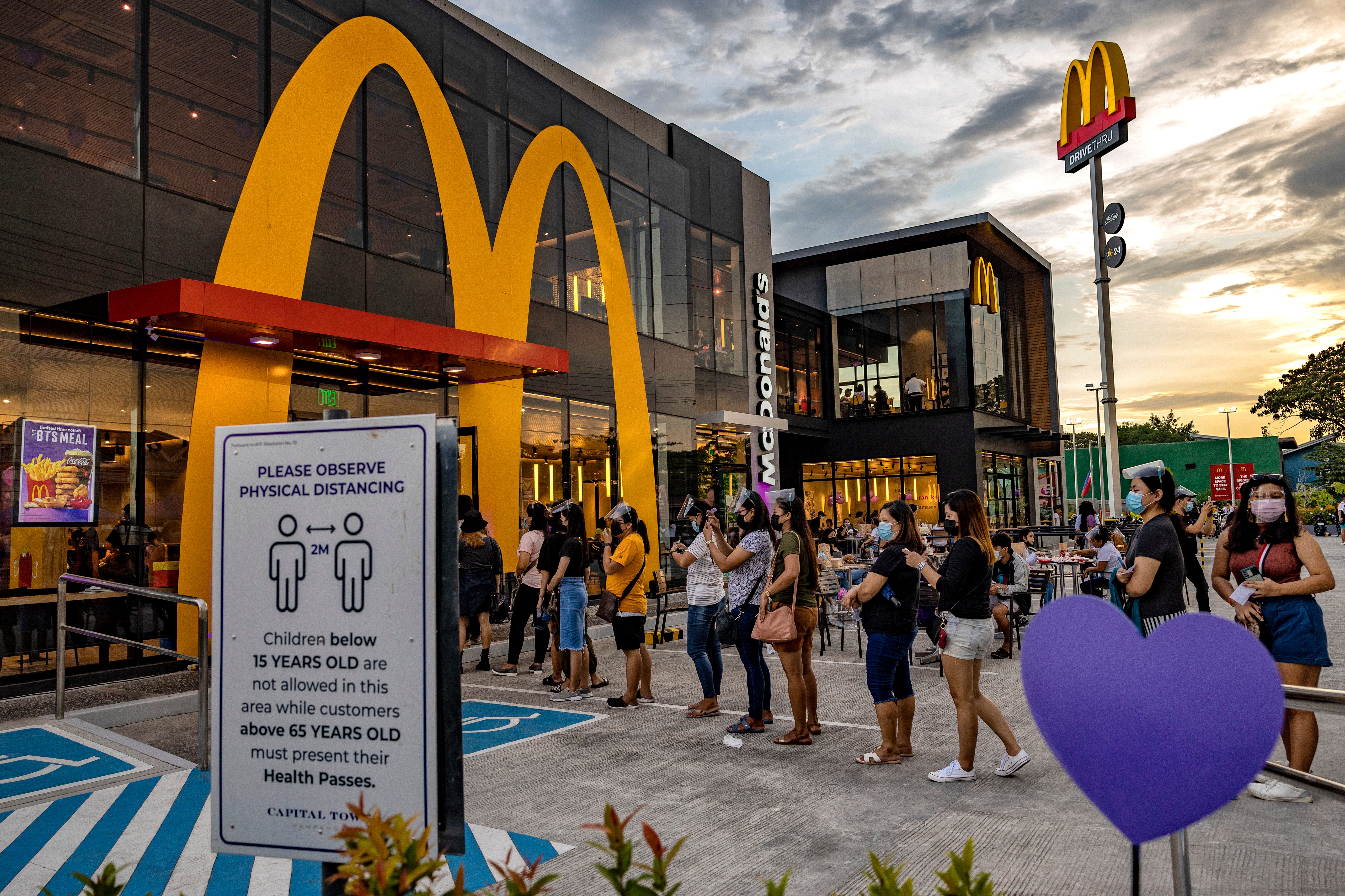 Customers queue at a McDonald's restaurant during the launch of the BTS Meal on June 18, 2021 in San Fernando, Pampanga province, Philippines.
