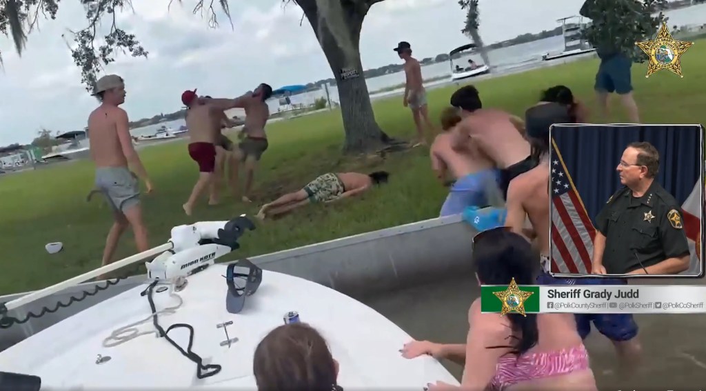 Screenshot of a large fight near a lake, with Sheriff Grady Judd inset.