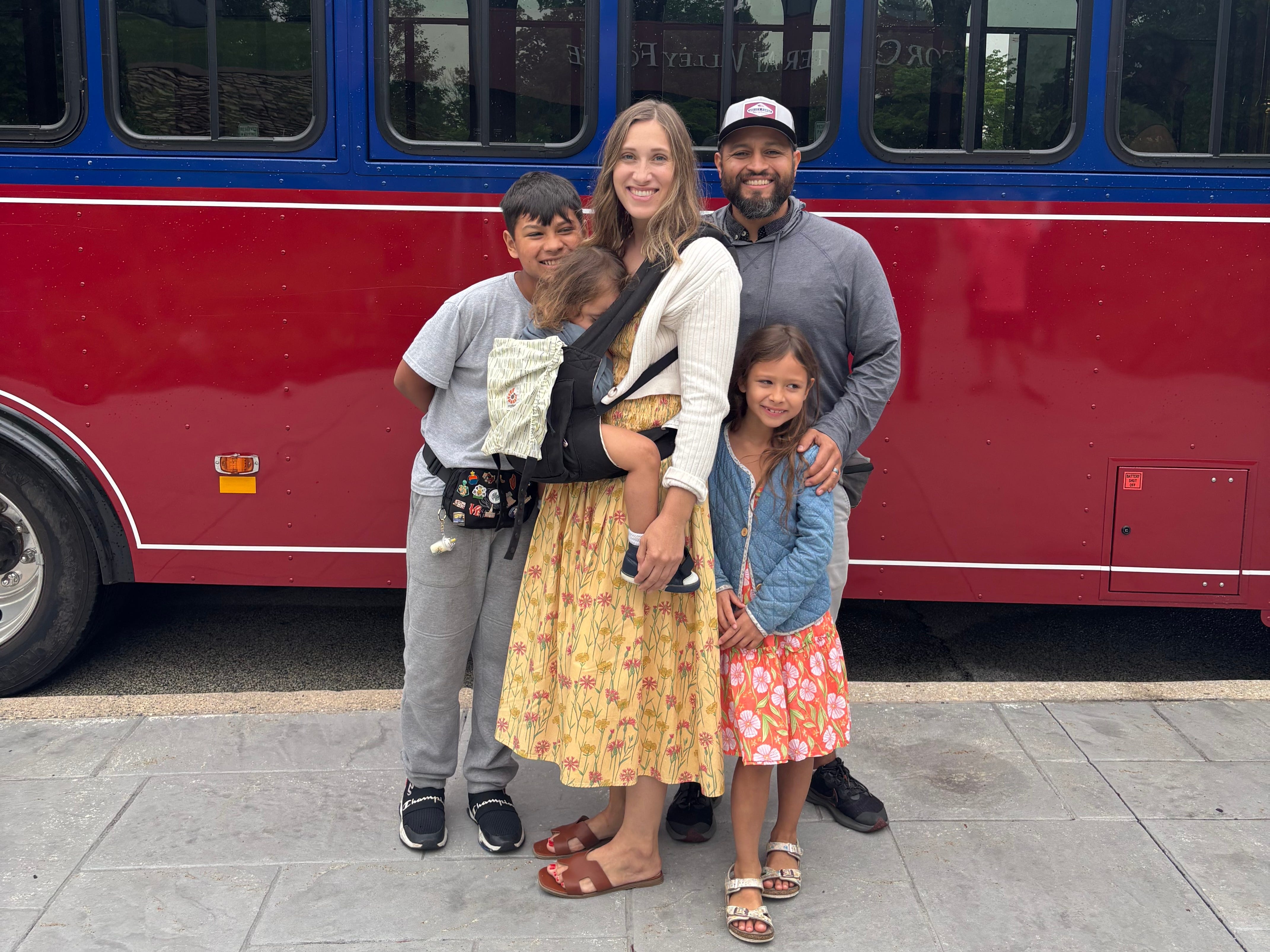 The author and her family in front of a trolley.