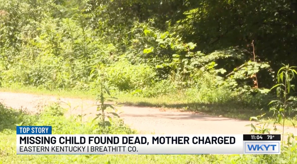 News footage of a wooded area where a missing child was found dead.