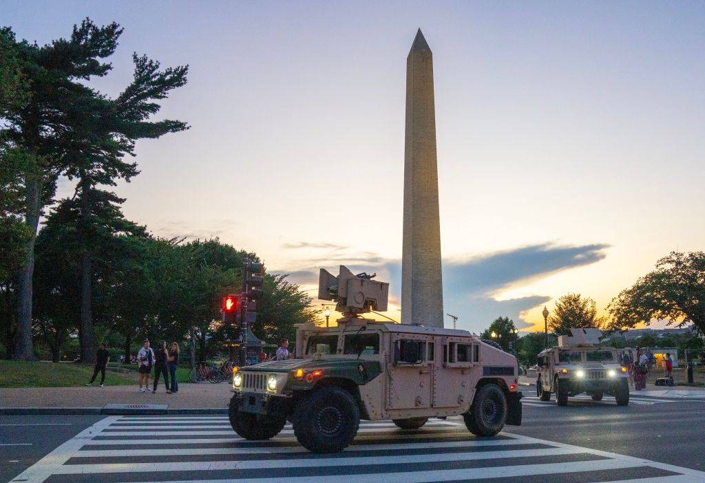 A National Guard vehicle drives through the streets of Washington, DC, near the National Mall on Aug. 12, 2025.