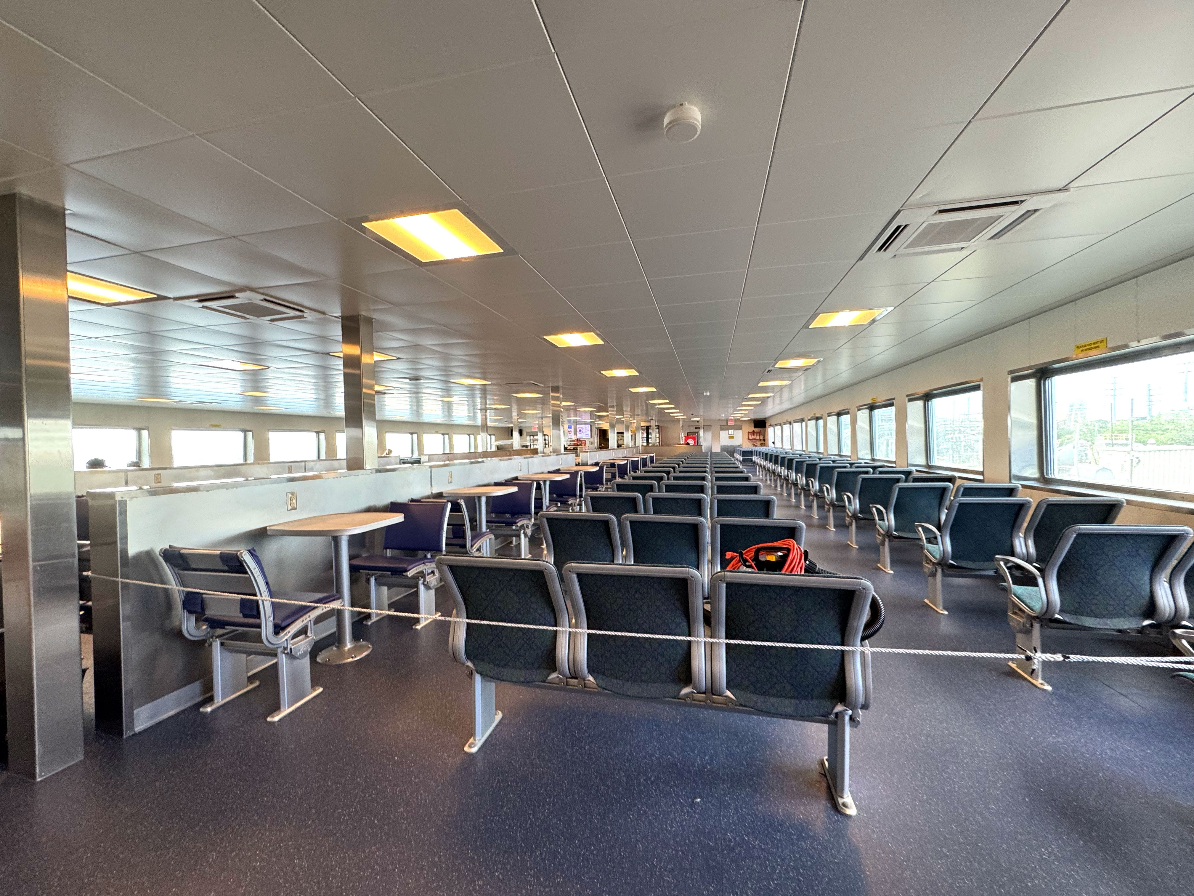 Rows of empty seats on a ferry.