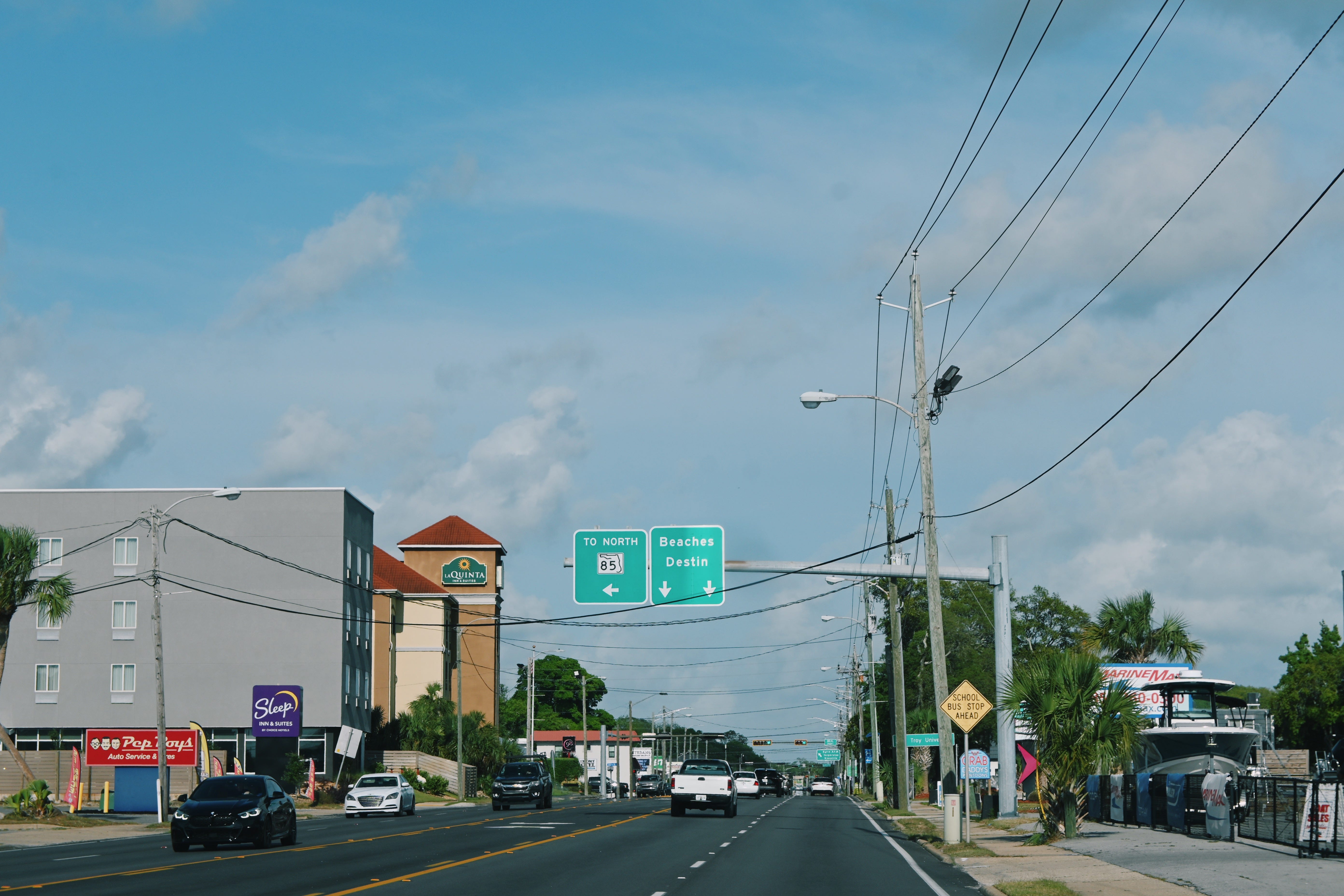 Street in Florida with sign for Beaches Destin