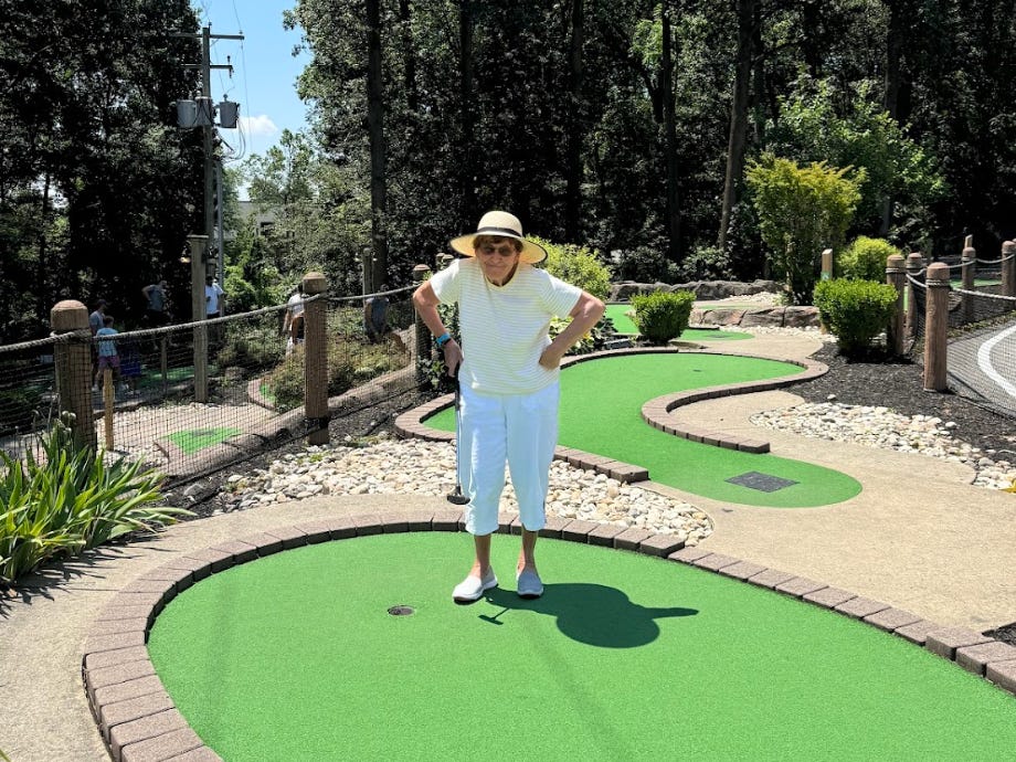 The writer's grandmother mini-golfing on a camping trip.