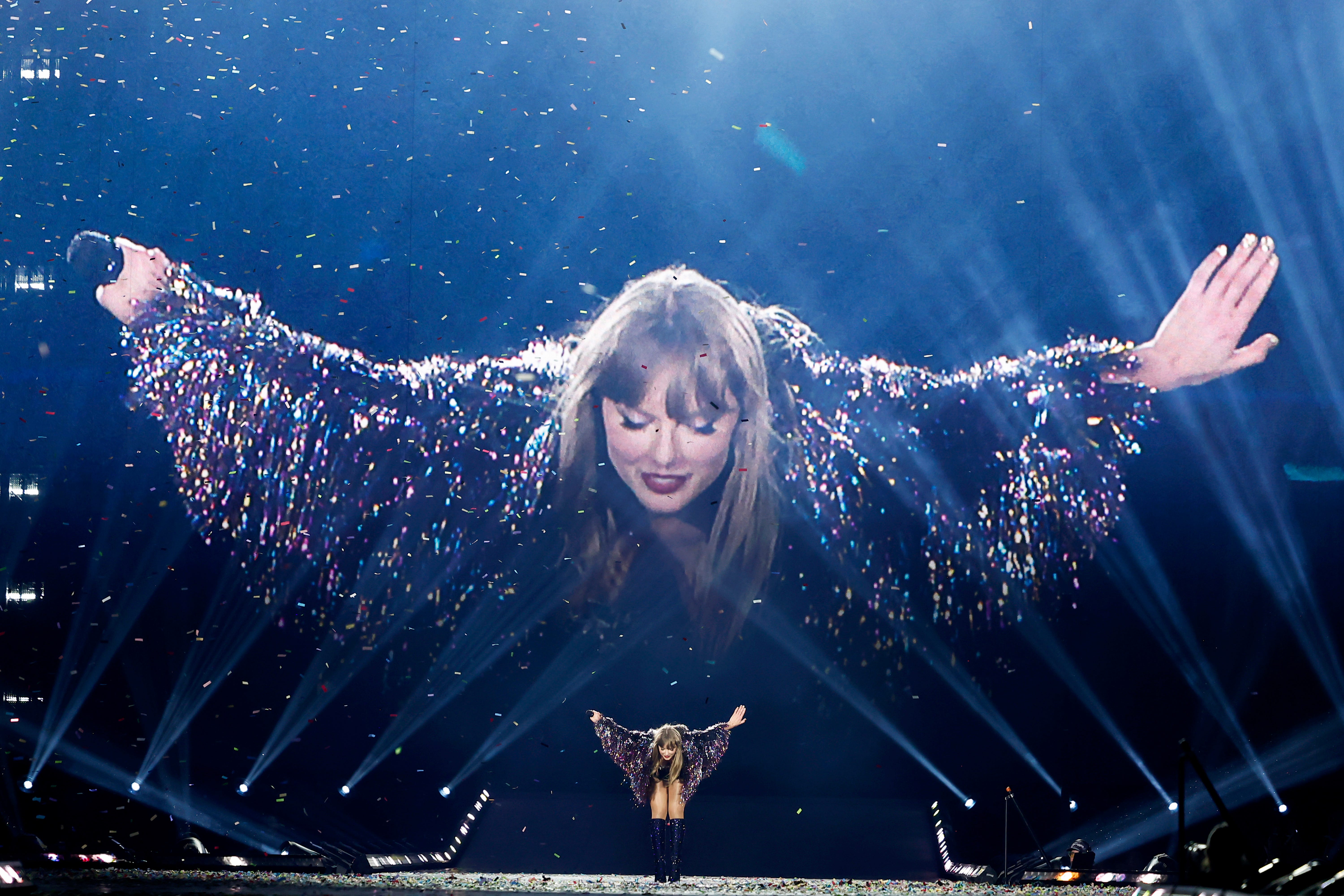 Taylor Swift takes a bow while performing at the Eras Tour.