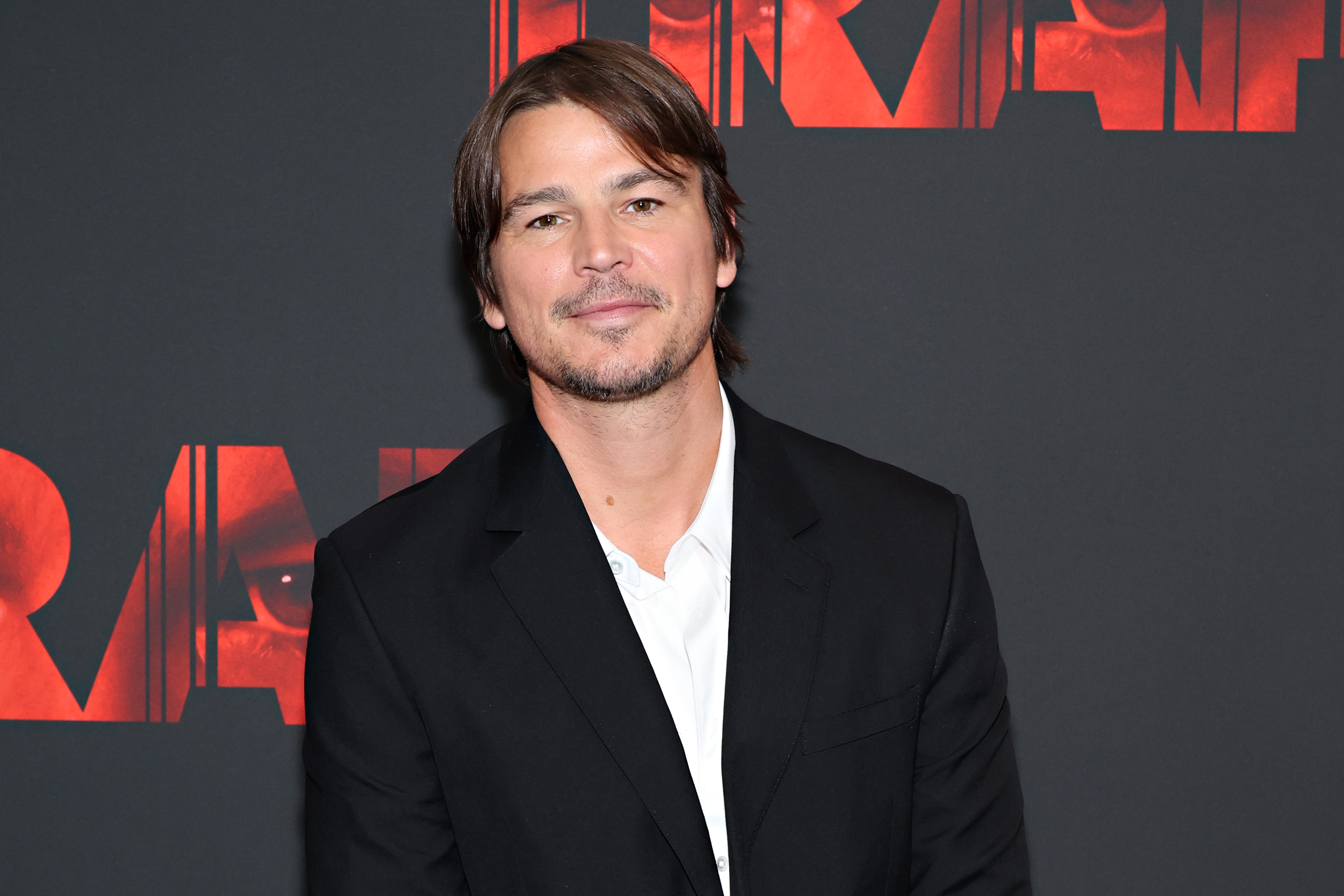 Josh Harnett in a black jacket