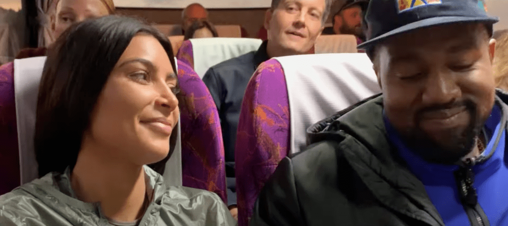 Kim Kardashian and Kanye West smiling together.