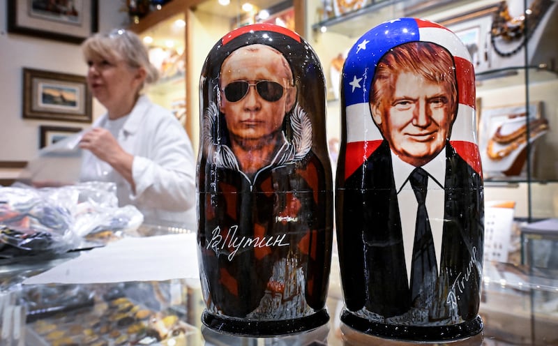 Traditional Russian wooden nesting dolls depicting Russian President Vladimir Putin and U.S. President Donald Trump are displayed for sale at a gift shop in downtown Moscow on August 13, 2025.