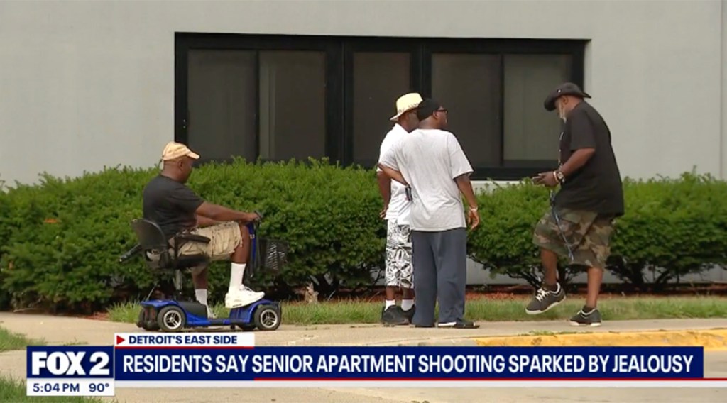 Several senior citizens outside a Detroit apartment building after a shooting.