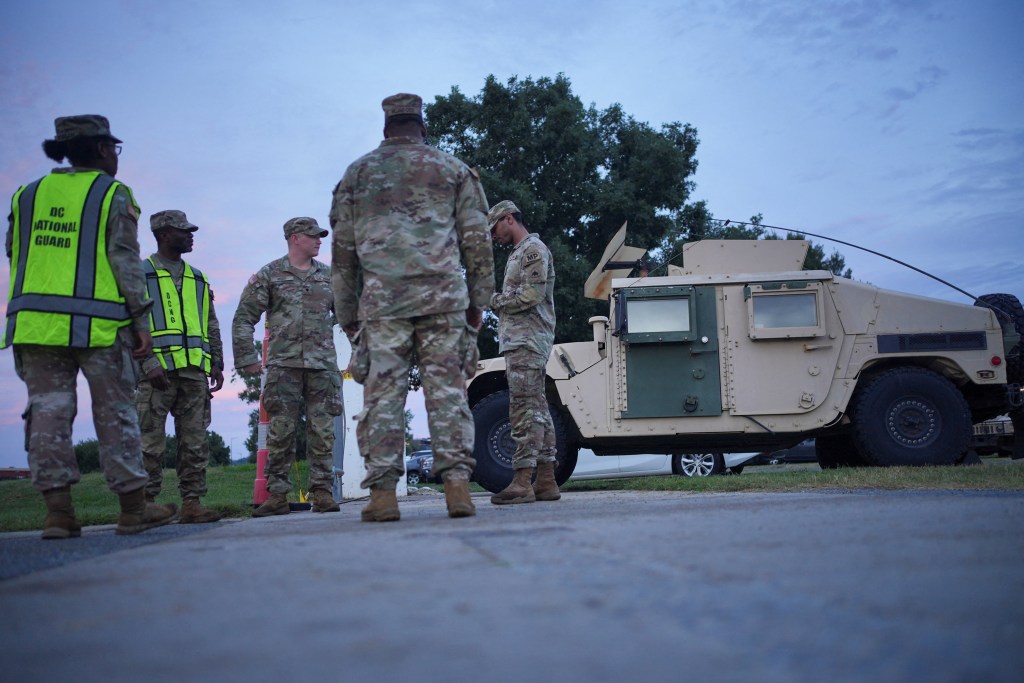 National Guard members gather at the US Park Police Anacostia Operations Facility after their deployment in Washington DC on Aug. 13, 2025.
