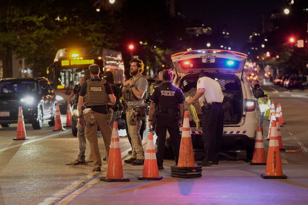 Metropolitan Police and Department of Homeland Security Investigations agents set up a traffic checkpoint along 14th Street on Aug. 13, 2025.