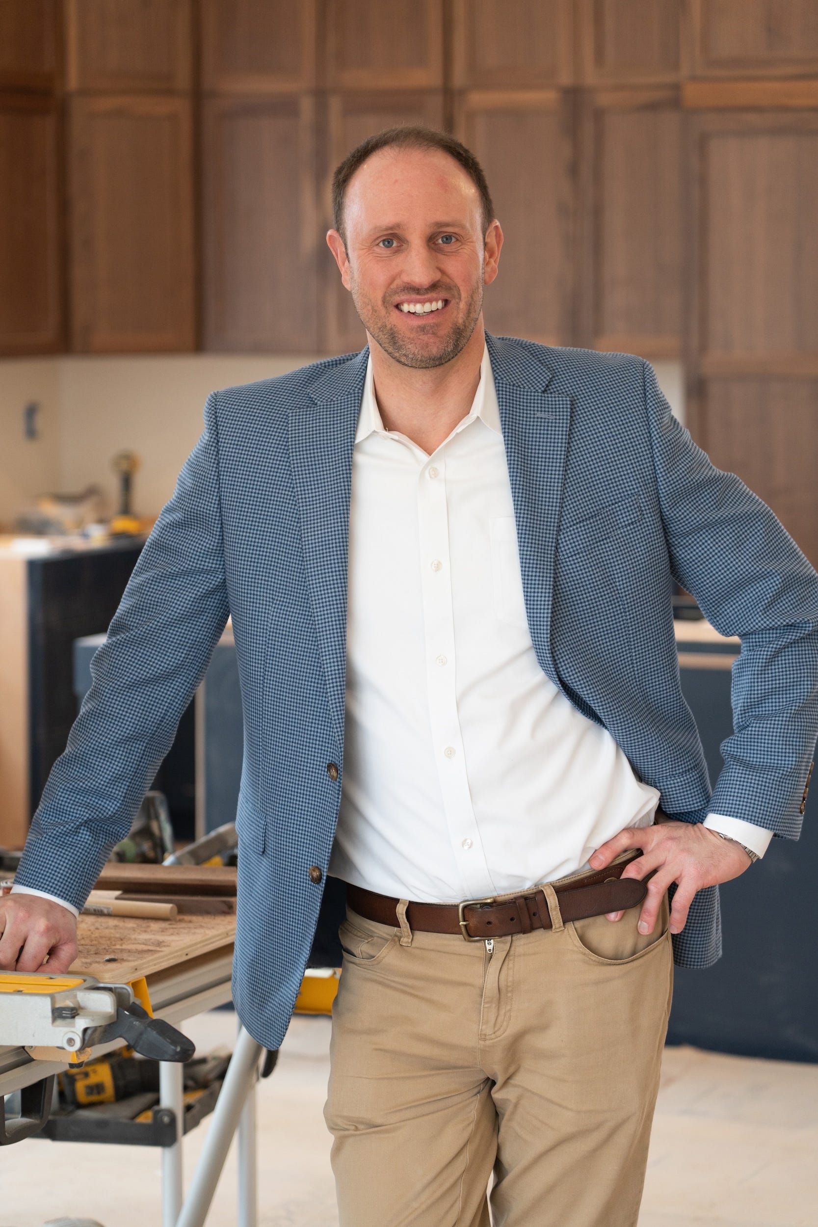 A professional picture of a man in a kitchen.