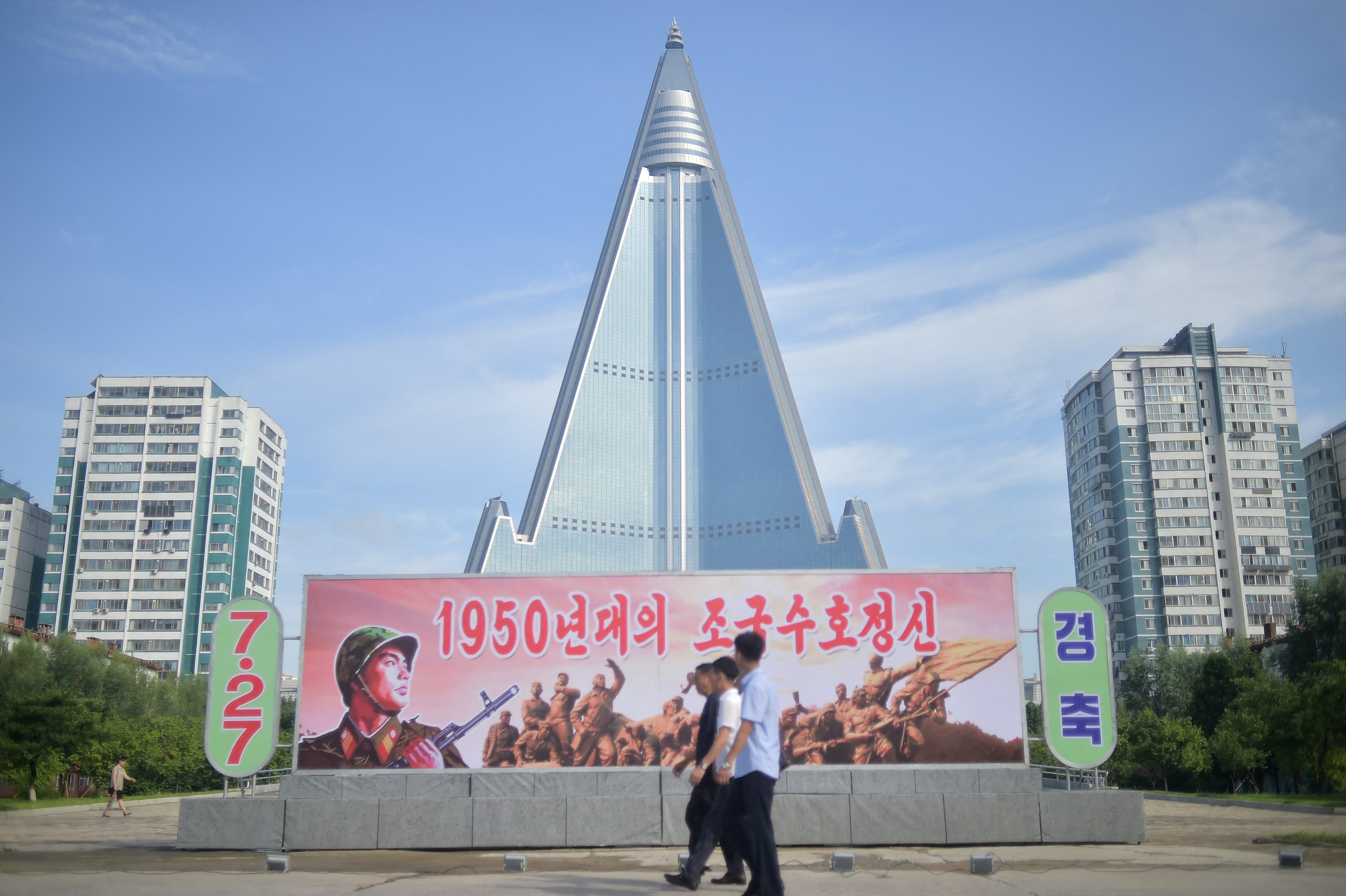 In 2023, signs in front of the Ryugyong Hotel in North Korea marked the 70th anniversary of the end of the Korean War.