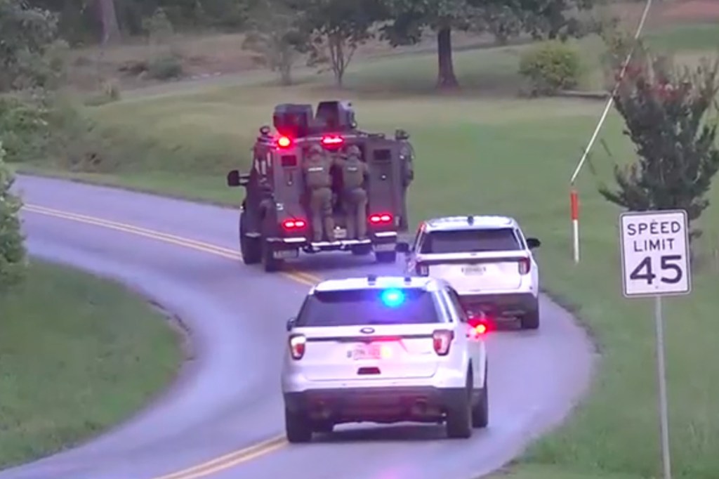 Police vehicles on a road.
