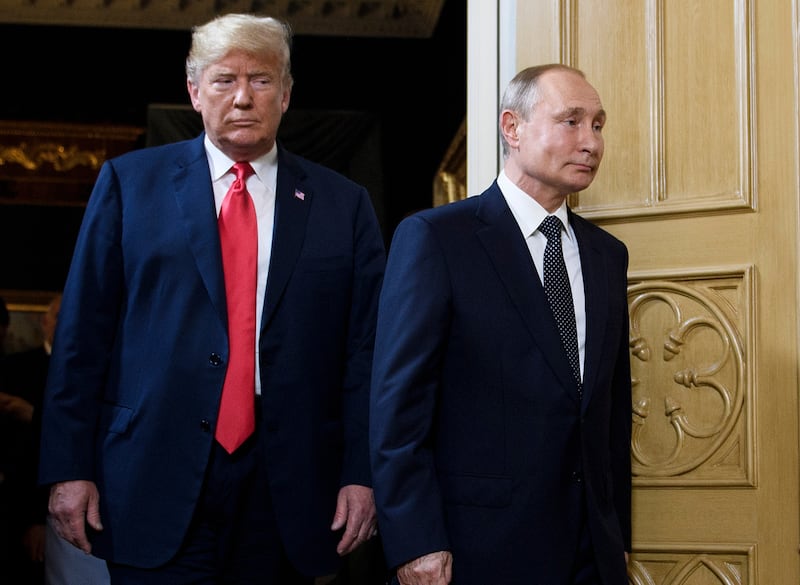 US President Donald Trump (L) and Russian President Vladimir Putin arrive for a meeting in Helsinki, on July 16, 2018.