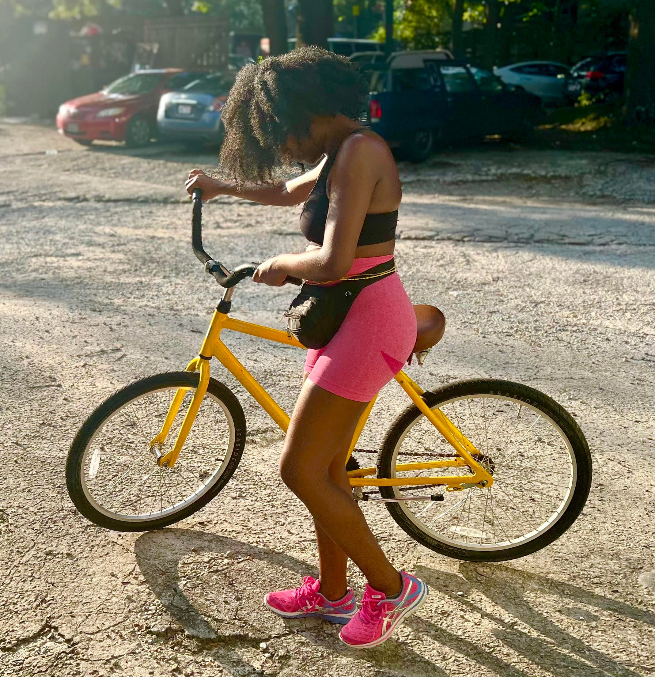 woman with a yellow bicycle