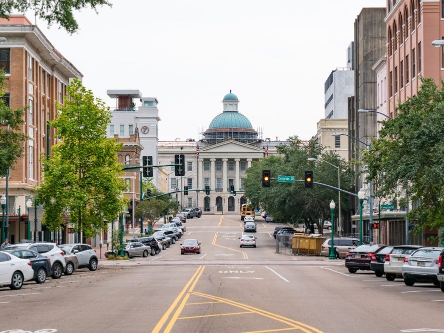 A street lined with cars in Jackson, Mississippi.