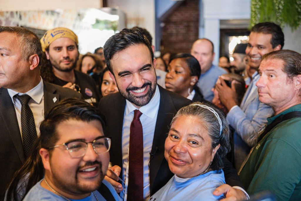 New York City mayoral candidate Zohran Mamdani surrounded by supporters at a campaign event in Istanbul Bay Authentic Mediterranean Restaurant in Staten Island, NY. 