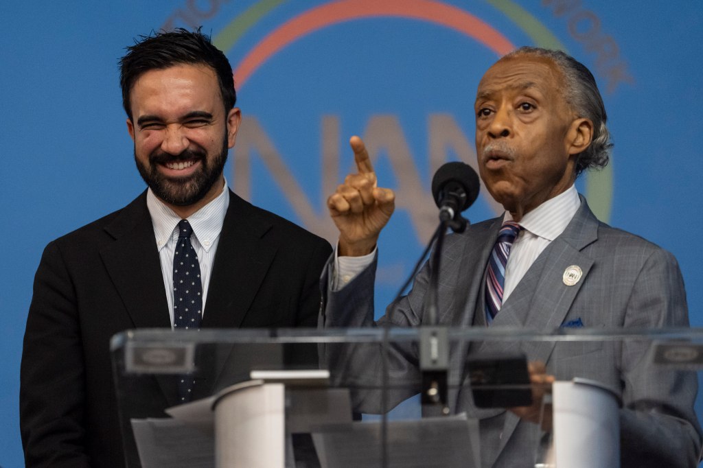 Rev. Al Sharpton, right, and Democratic mayoral candidate Zohran Mamdani, left, speak during the National Action Network's Saturday action rally at House of Justice in Harlem, Saturday, June 28, 2025, in New York.