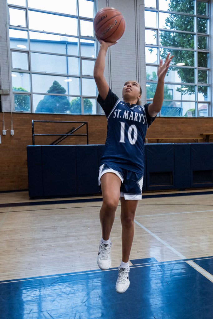 Delaney Walters from Centereach goes up for a layup at St. Mary's high school gym.