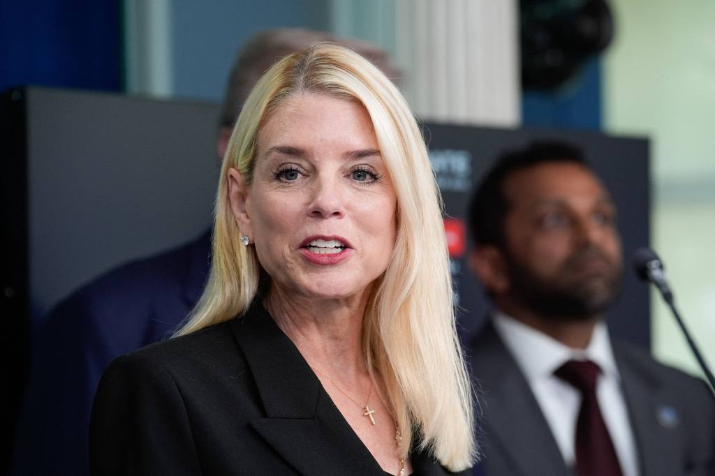 Pam Bondi speaking at a press conference.
