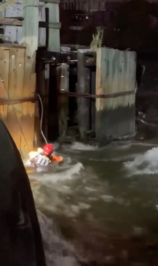 FDNY rescuers pulled a struggling person from the East River after strong currents pinned them against the Roosevelt Island Bridge late Wednesday, dramatic footage shows.