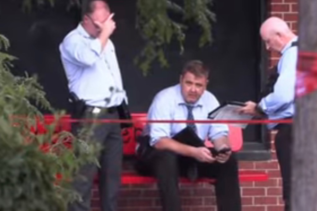 Detectives at the scene of the shooting where Kevin Watson was gunned down.